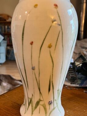 Sheepscott River Pottery tall fluted vase in Meadow design. Vase stands 10 1/2”.